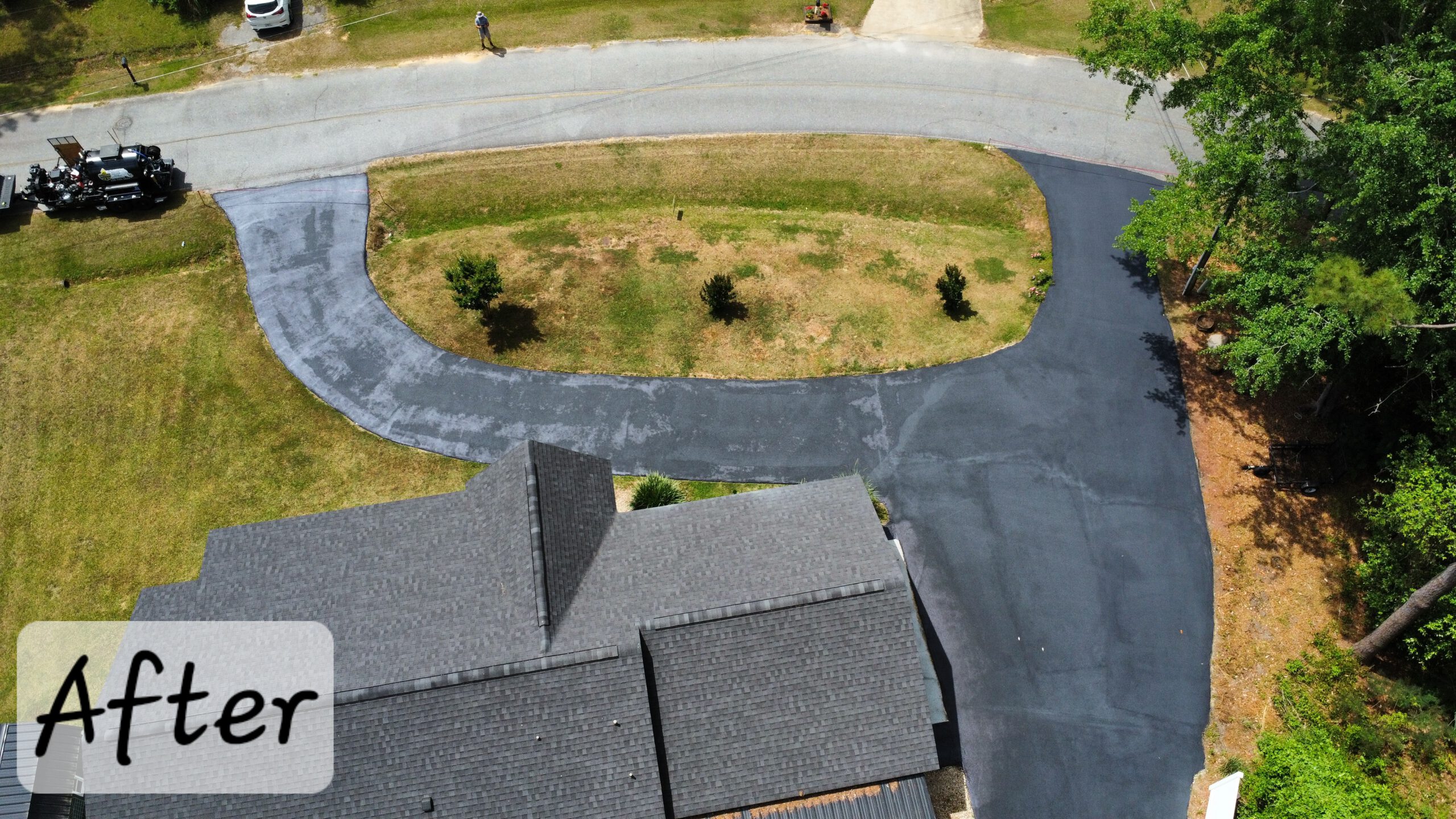 Rich black sealcoated residential driveway