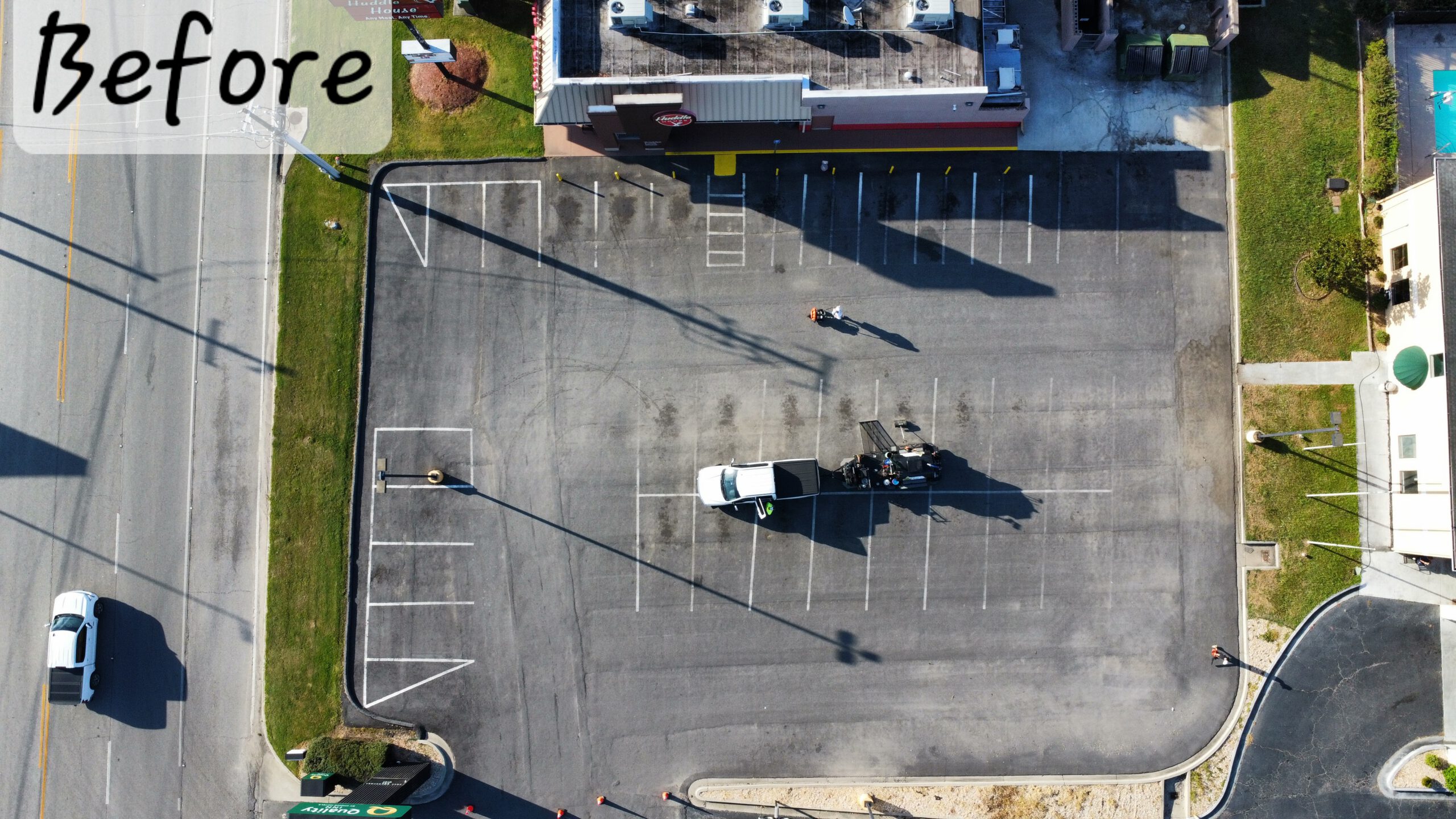 Commercial lot with faded barely visible parking lines