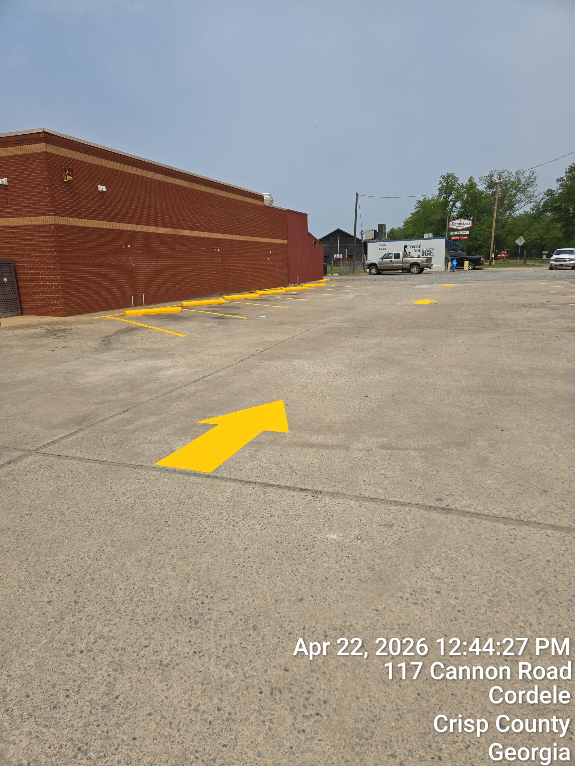 Fresh directional arrow markings at Striplings parking lot Cordele Georgia