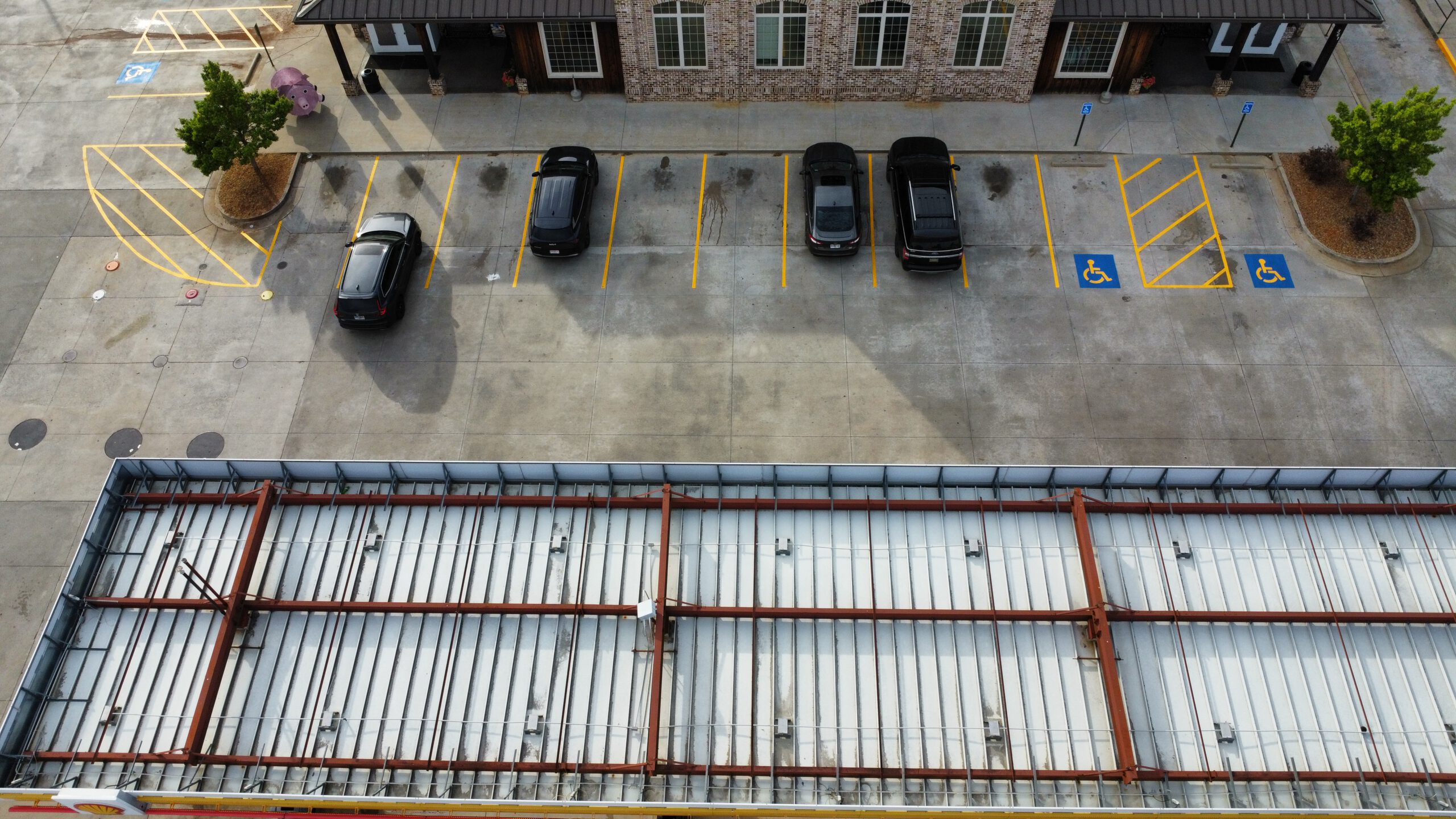 Parking lot with fresh yellow striping and accessible spaces