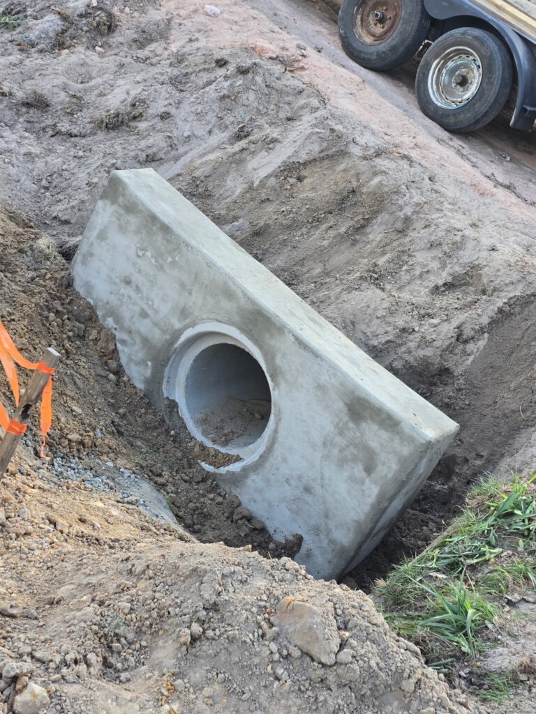 Precast concrete structure set in an excavation on a commercial site