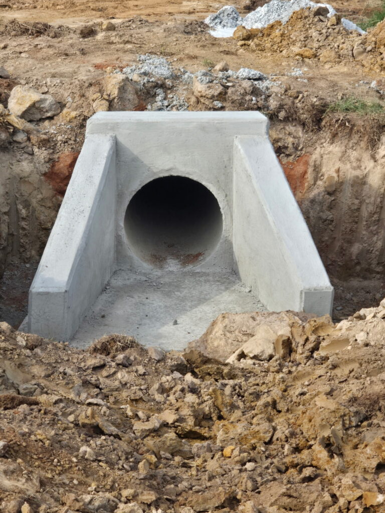 Finished concrete headwall and apron on a single pipe culvert